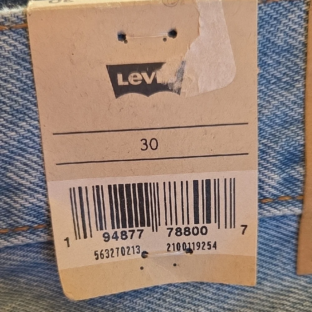 Levi's 501 Light Blue Distressed Jean Shorts‎
